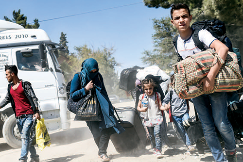 A family fleeing down the road