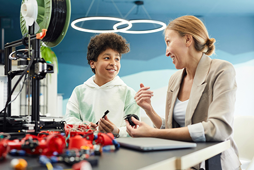 Teacher working with student