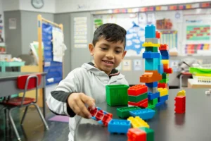 Students working with building materials in class