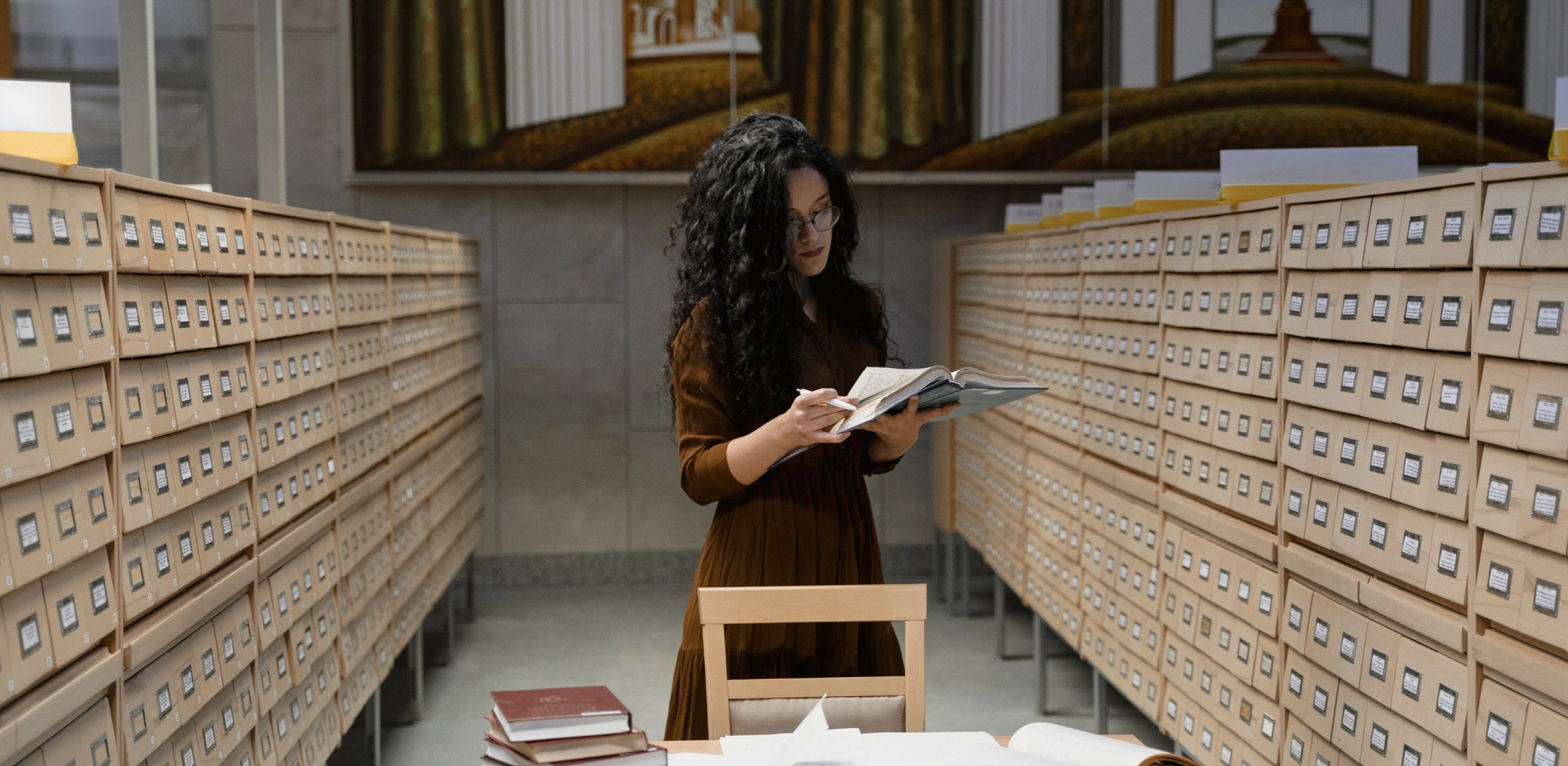 Woman reading in archive section