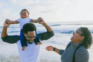 Parents and child on beach